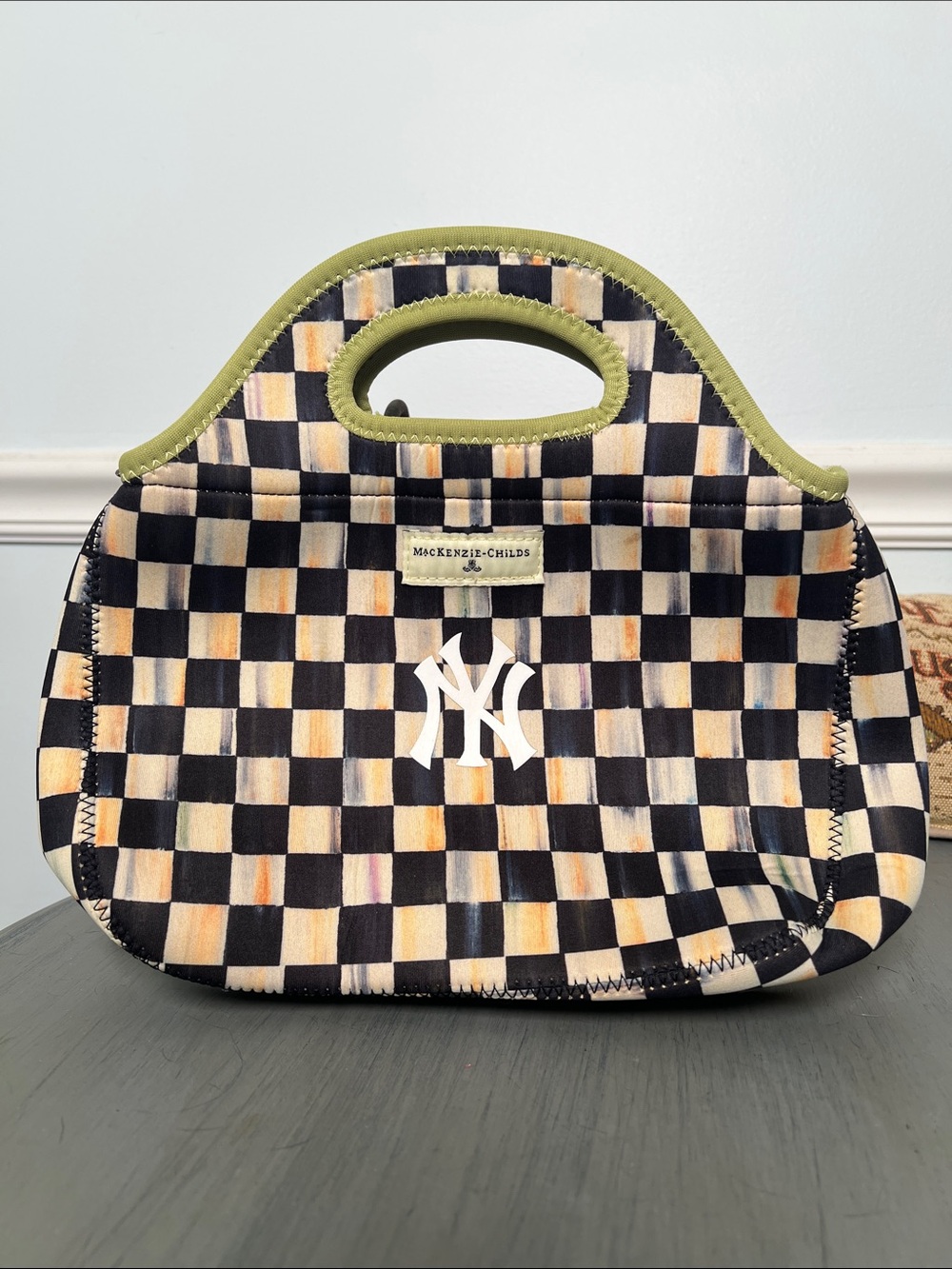 MacKenzie-Childs Black and Cream Checkerewith Olive Trim and NY Logo. Neoprene.